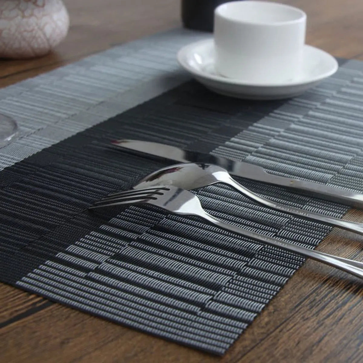 PVC non-slip place mat in gradient bamboo colour on a kitchen countertop.