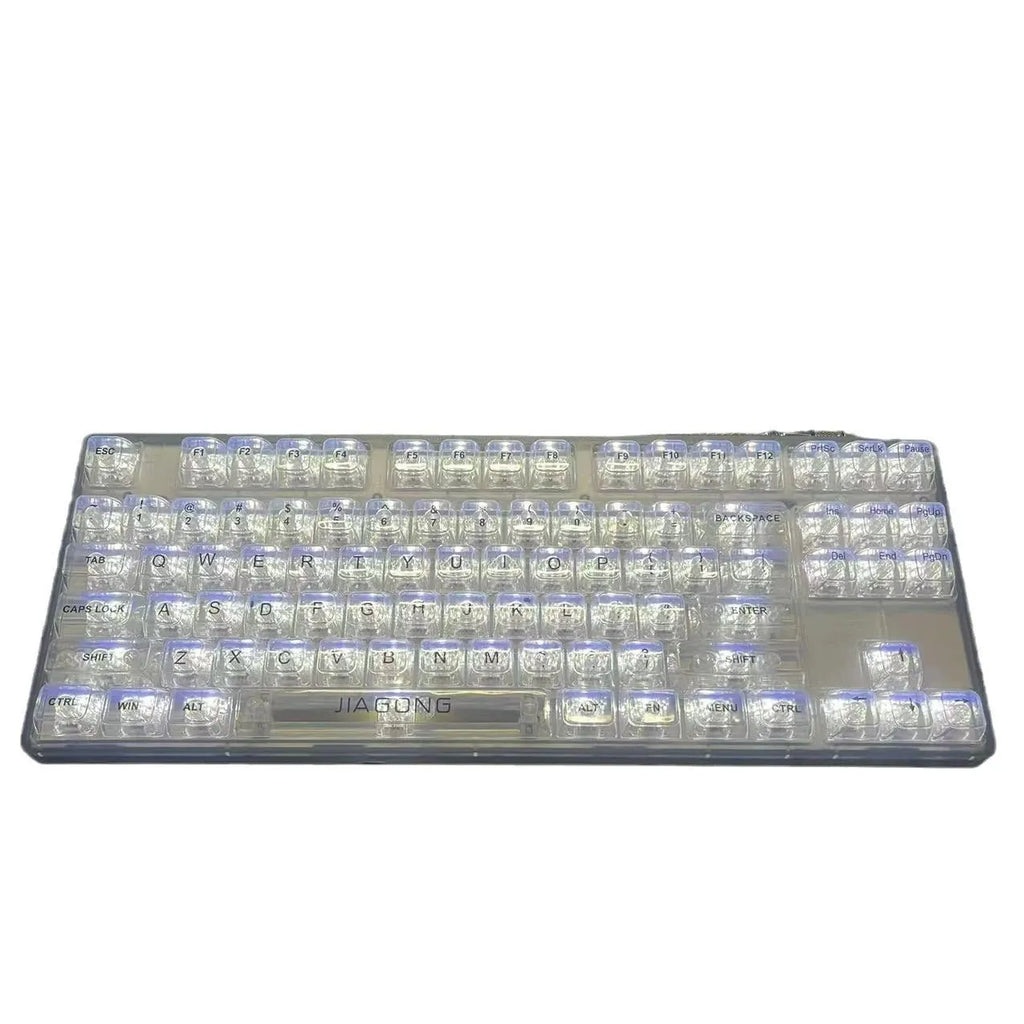 132 transparent plastic key caps arranged for a full-size keyboard layout