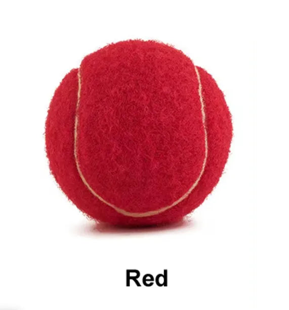Bright pink durable rubber dog tennis ball with bite-resistant design for aggressive chewers.