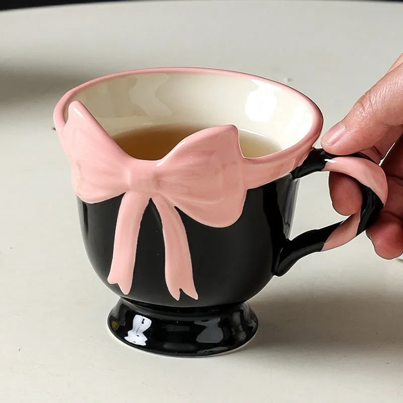 Ceramic heart bow mug with 350ml capacity in black pink colour option