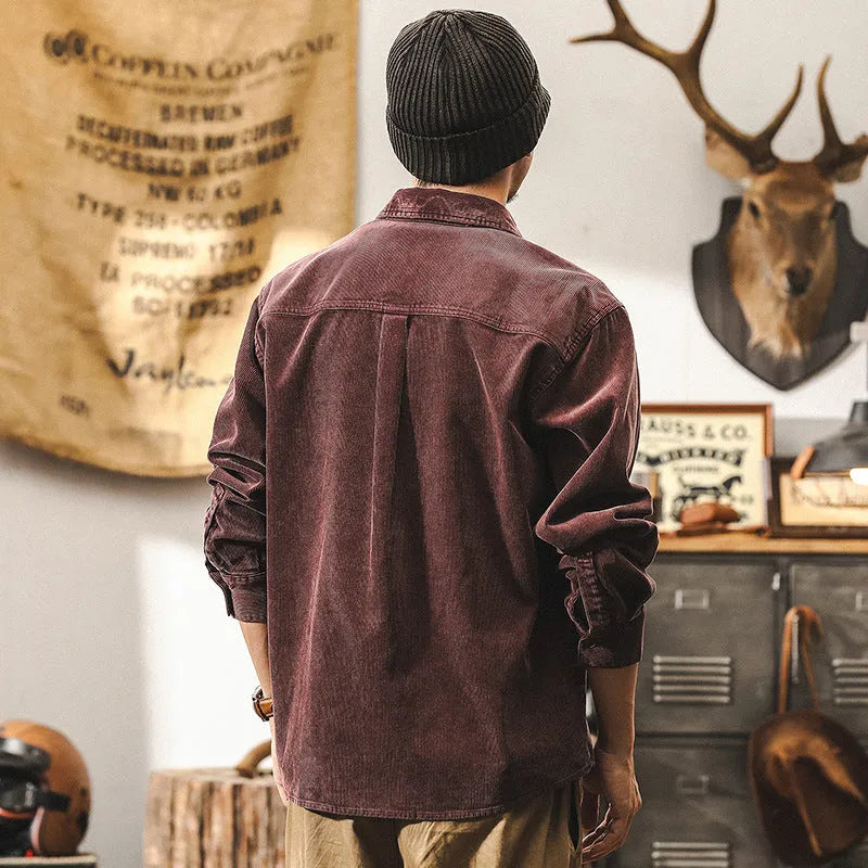 Men's loose-fit retro corduroy shirt jacket in red or black, showing long sleeves and textured fabric.
