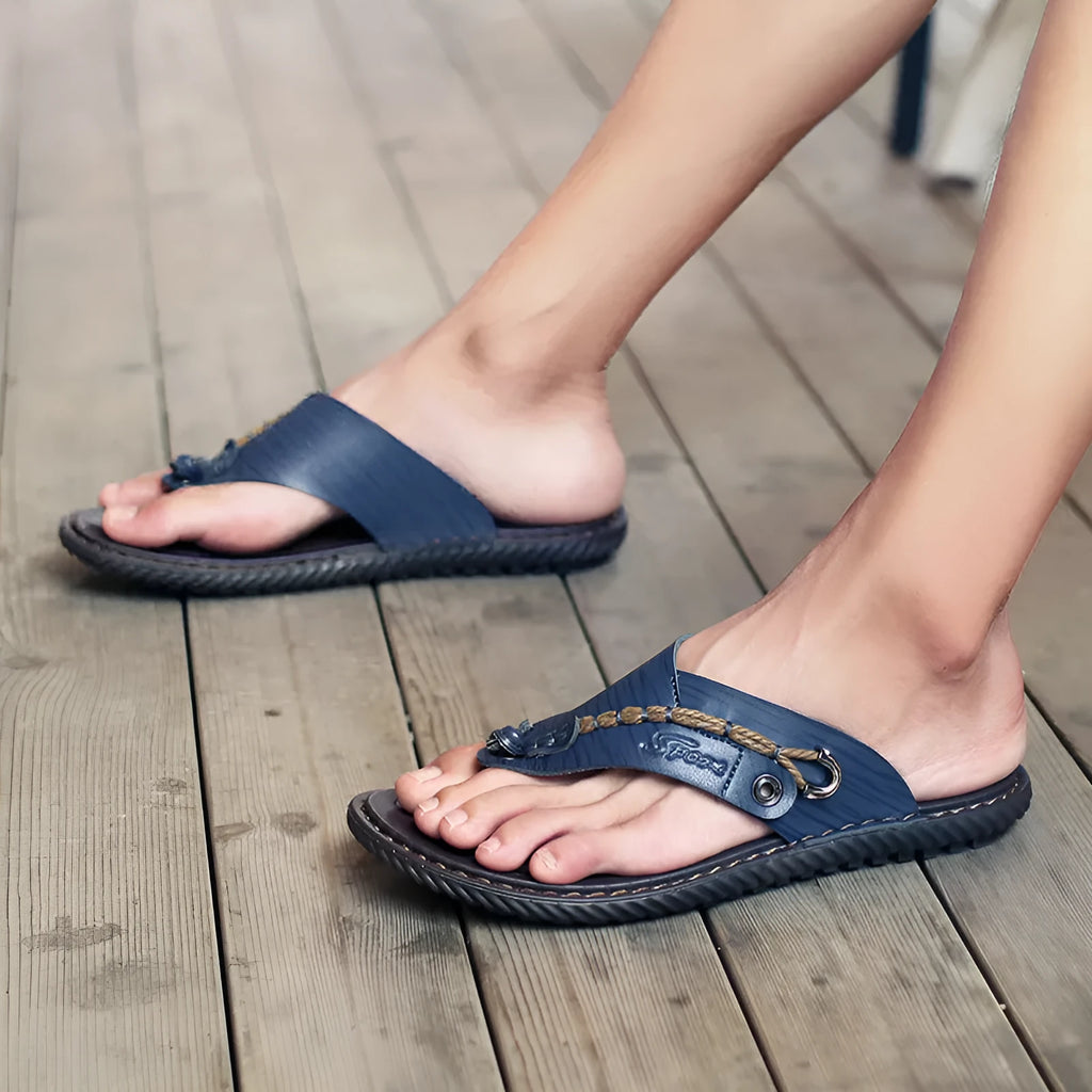 Men's black non-slip casual slippers with PU leather upper showing sole tread pattern
