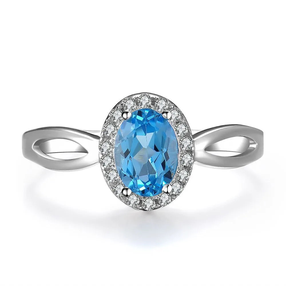 925 sterling silver blue topaz jewellery set with geometric design including earrings, ring, pendant and necklace