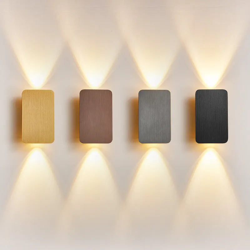 Minimalist Nordic-style LED wall lamp in black finish mounted on wall showing adjustable light settings