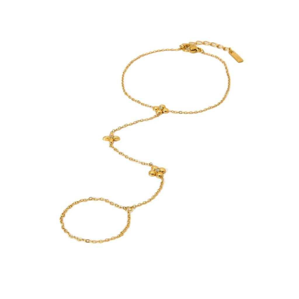 Gold geometric women's bracelet with floral and eight-pointed star design elements