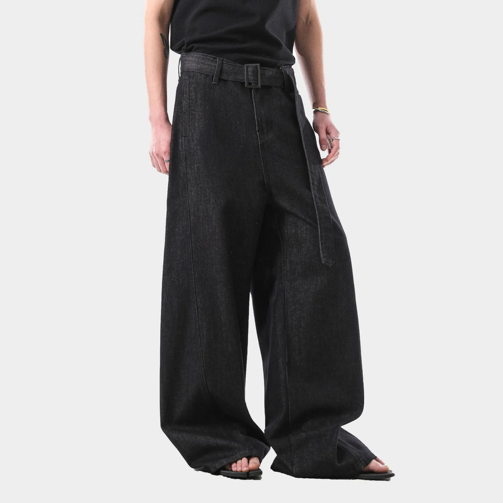 Black high-waist straight-leg denim jeans with a zip fly on a plain background.
