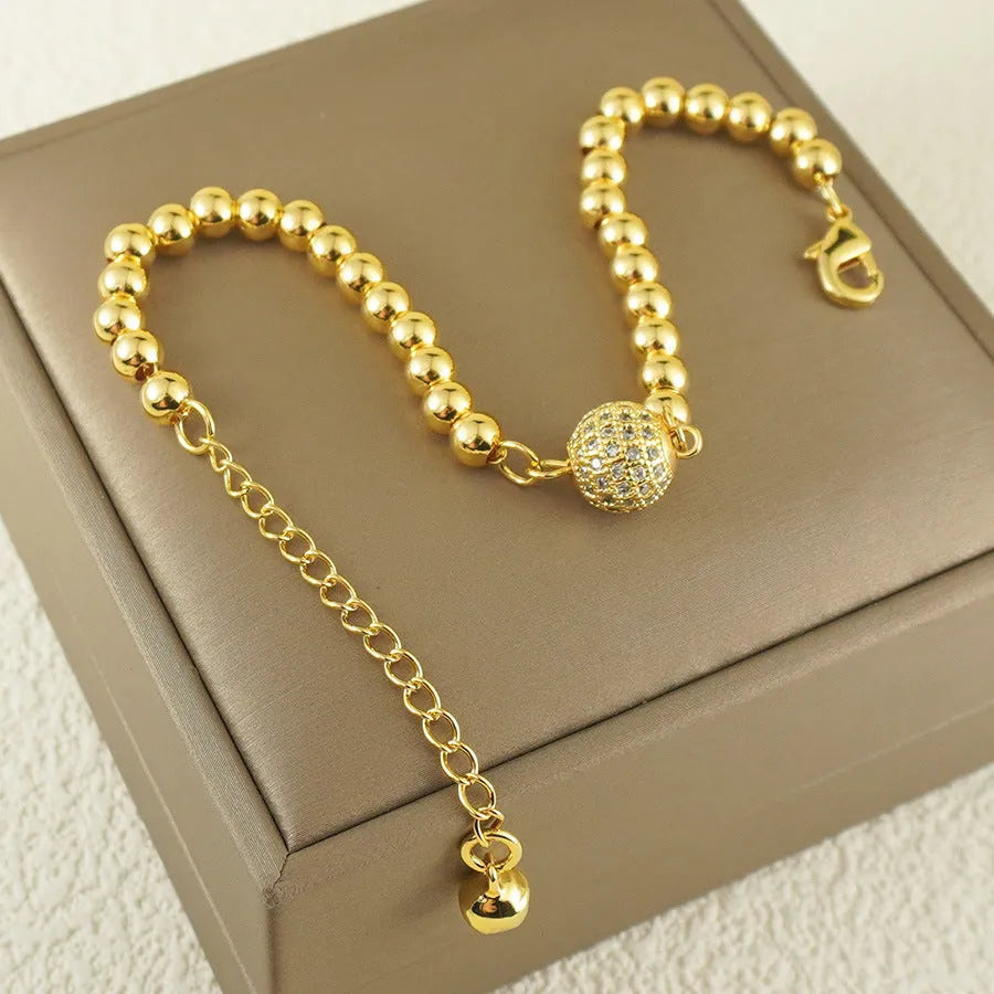 Women's heart-shaped copper bracelet with single ball zircon accents and electroplated finish