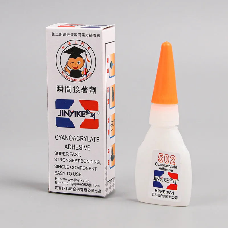 Tube of specialised shoe repair glue for strong, permanent adhesive patches on footwear.