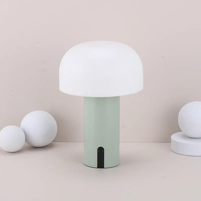 Decorative LED mushroom night light with touch switch in warm white, on a bedside table