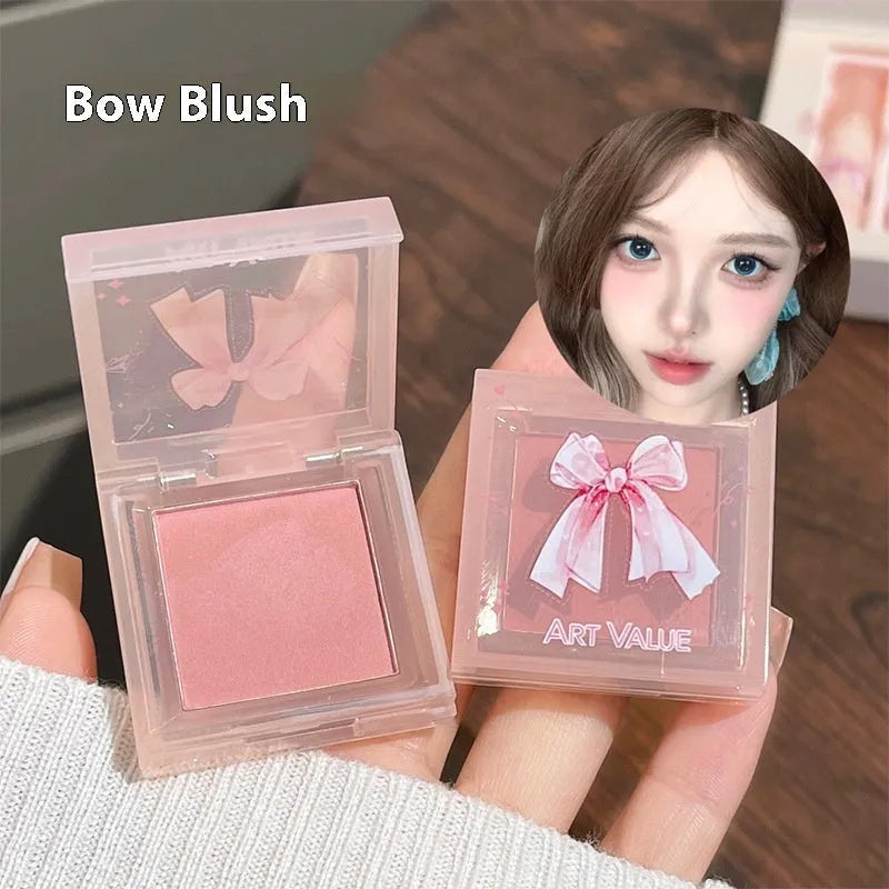 Butterfly Box Suite cosmetics set with four lip mud pots, powder blusher, and necklace in pink packaging