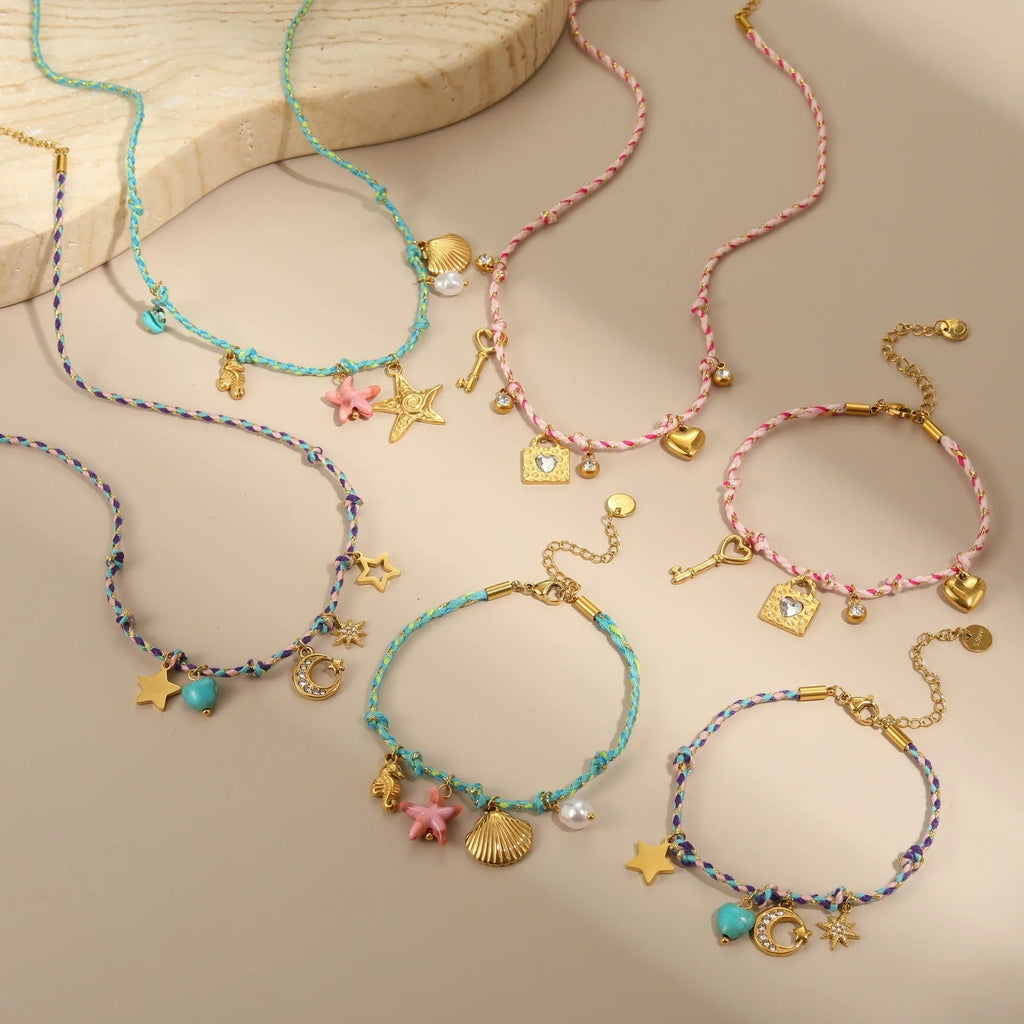 Handmade colour braided rope and stainless steel necklace with heart-shaped pendant on adjustable chain.