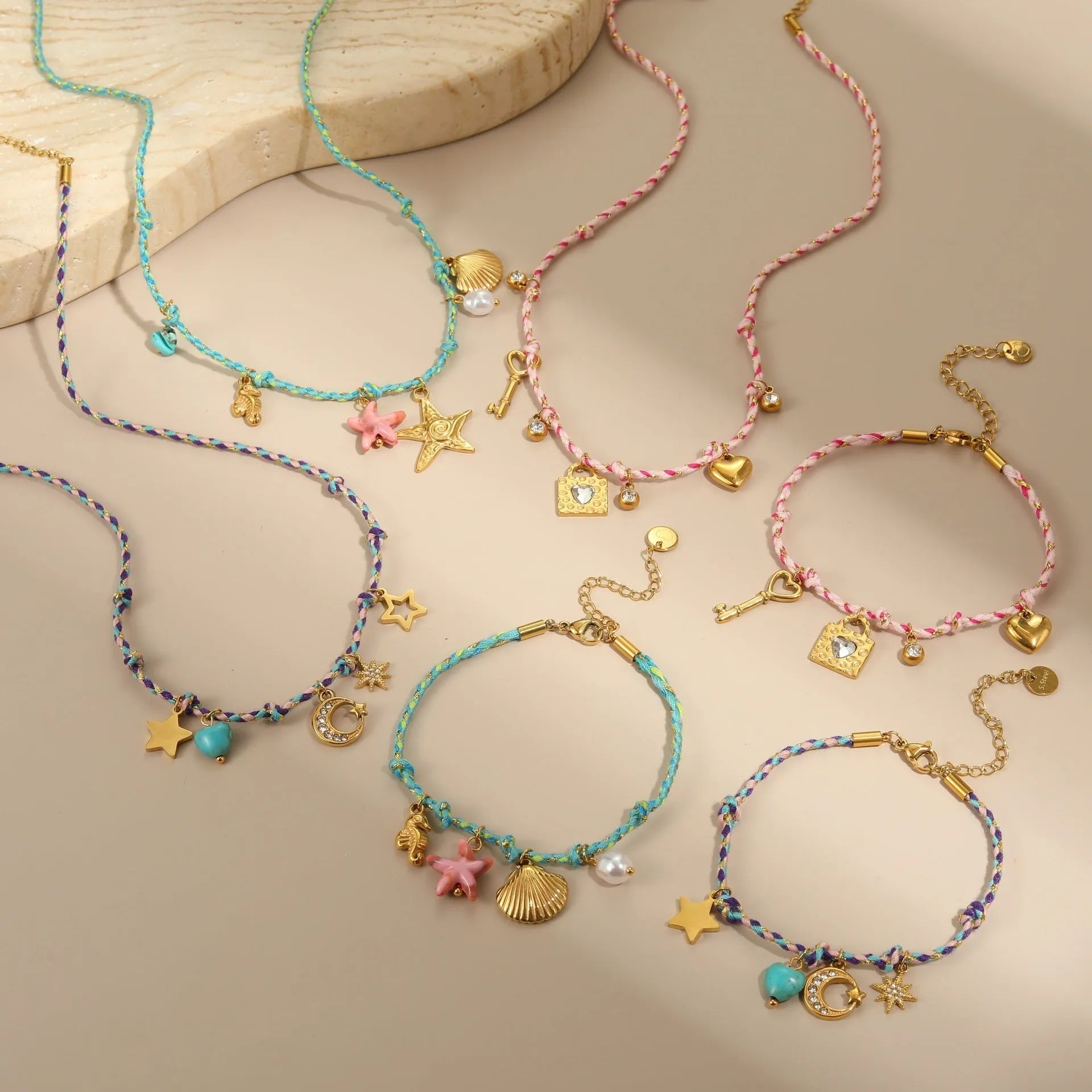 Handmade colour braided rope and stainless steel necklace with heart-shaped pendant on adjustable chain.