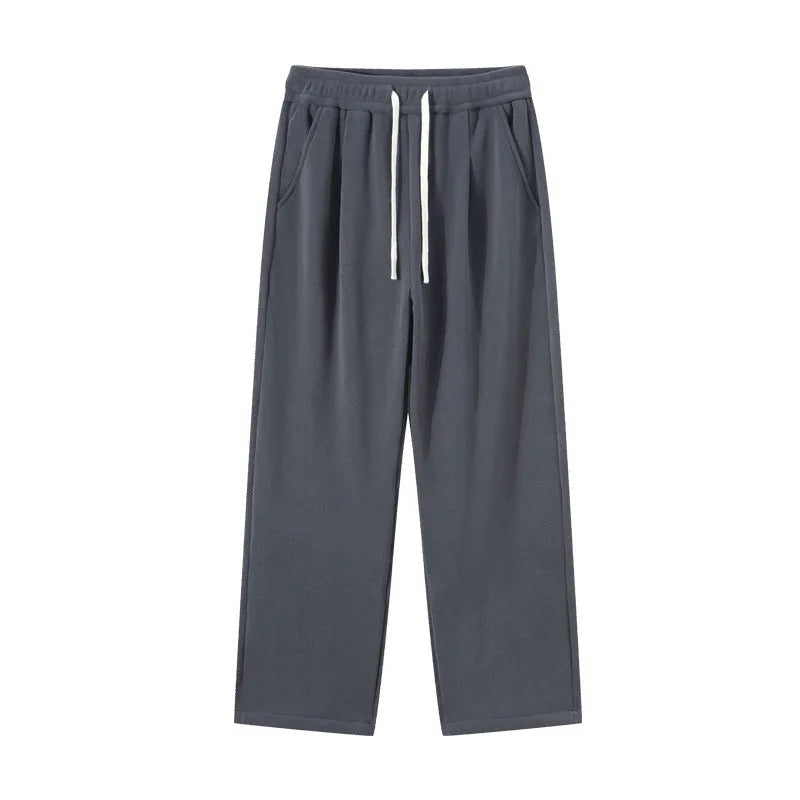 Men's apricot coloured loose-fit polar fleece trousers with a thick lining and drawstring waist.