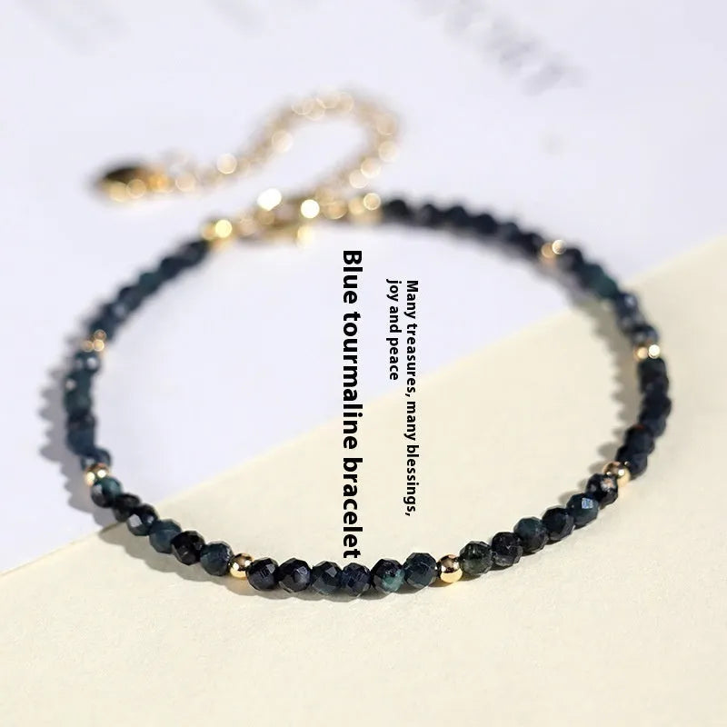 Blue tourmaline beaded bracelet with silver spacer beads and adjustable clasp