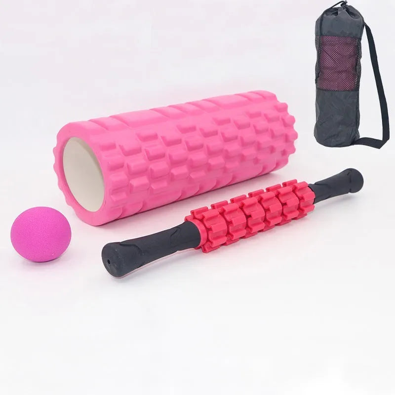Black foam roller massage stick with gear design, 33cm long, on a plain background.