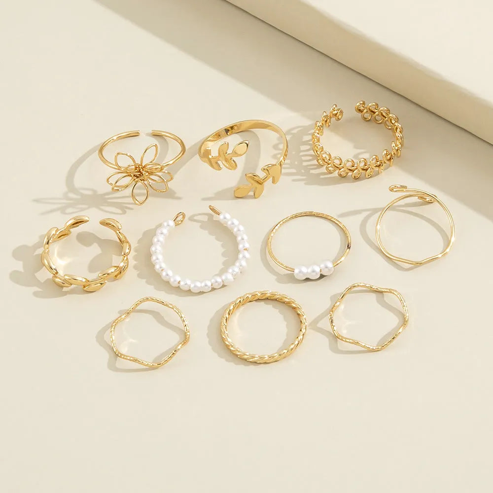 Gold colour openwork flower ring with electroplated glossy finish and floral design