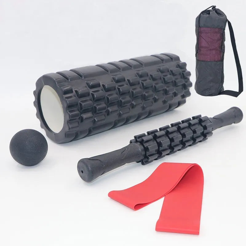 Black foam roller massage stick with gear design, 33cm long, on a plain background.