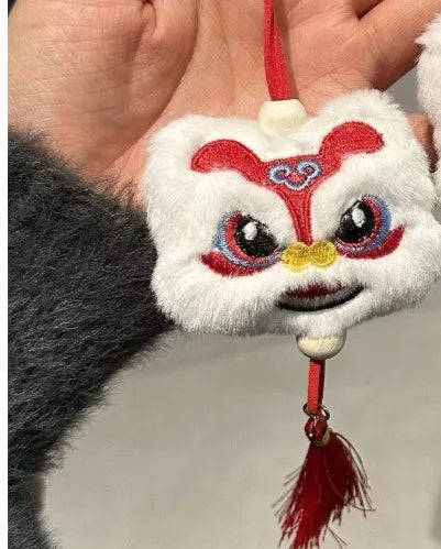 Blue handmade plush lion tassel keychain ornament with star stone detail