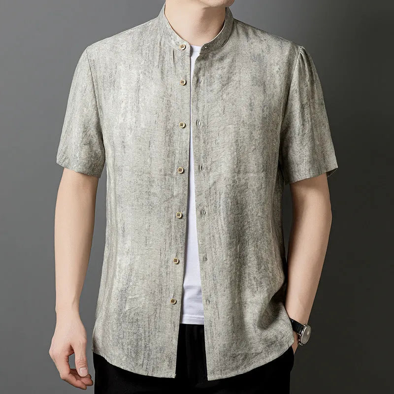 Men's loose grey linen shirt with stand collar, cardigan style, on a hanger.