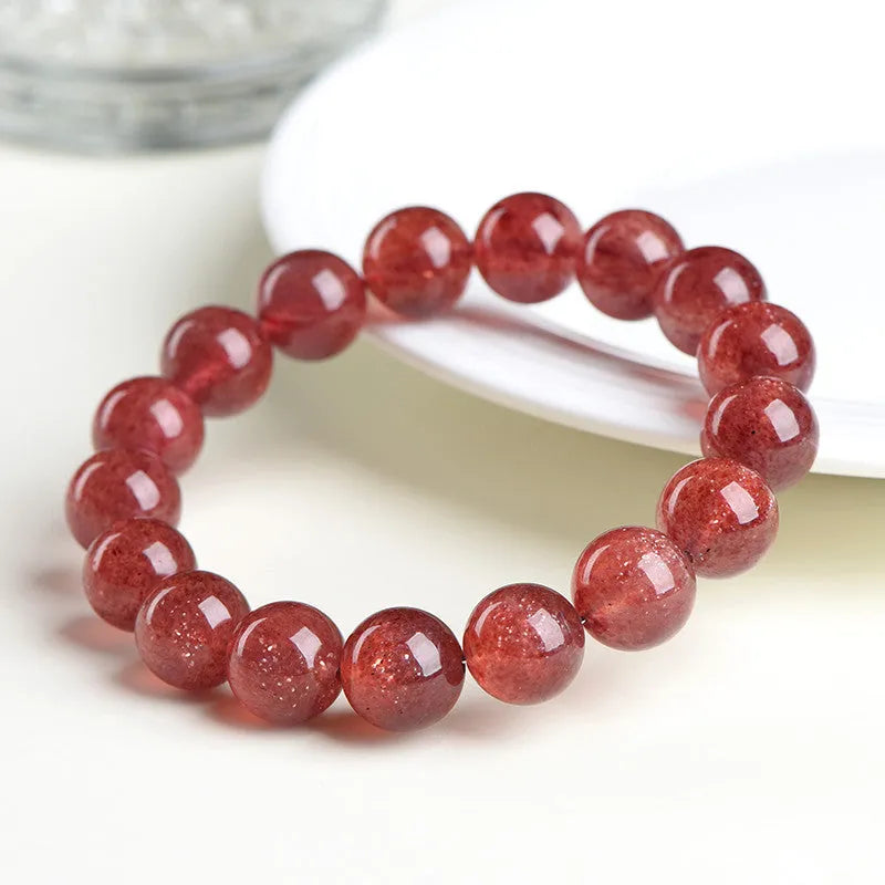 Polished cherry red strawberry quartz geometric bracelet on a white background, showing 3A and 5A grade options.