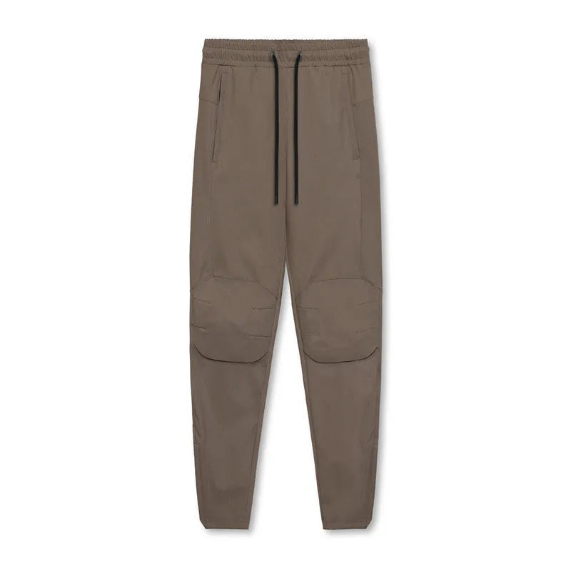 Men's loose-fit ankle-tied trousers in olive green, suitable for fitness and casual wear.