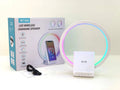 White smart Bluetooth speaker with 15W wireless charging surface and USB port on desktop