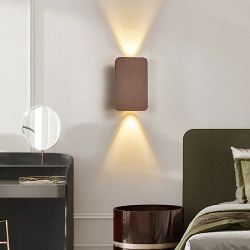 Minimalist Nordic-style LED wall lamp in black finish mounted on wall showing adjustable light settings