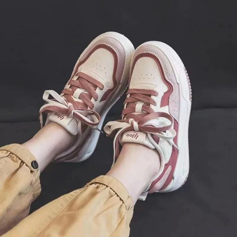 Women's pink and white low-top sneakers with a rubber sole, shown in sizes 35 to 40.