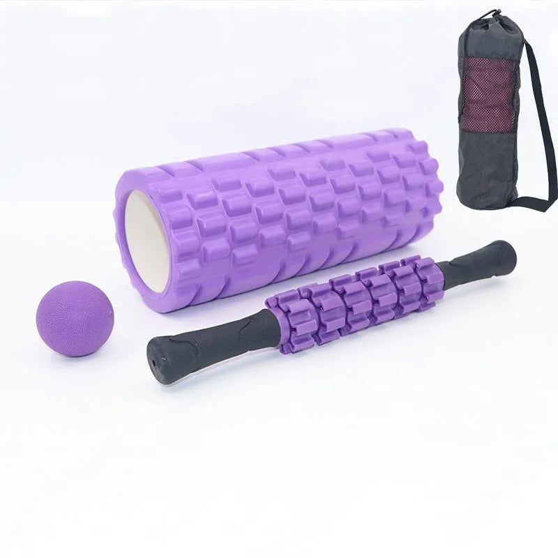 Black foam roller massage stick with gear design, 33cm long, on a plain background.