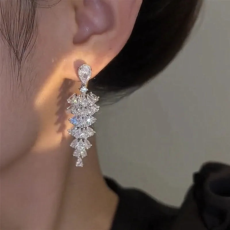 Silver pagoda Christmas tree drop earrings with sparkling zircon detail on copper studs.