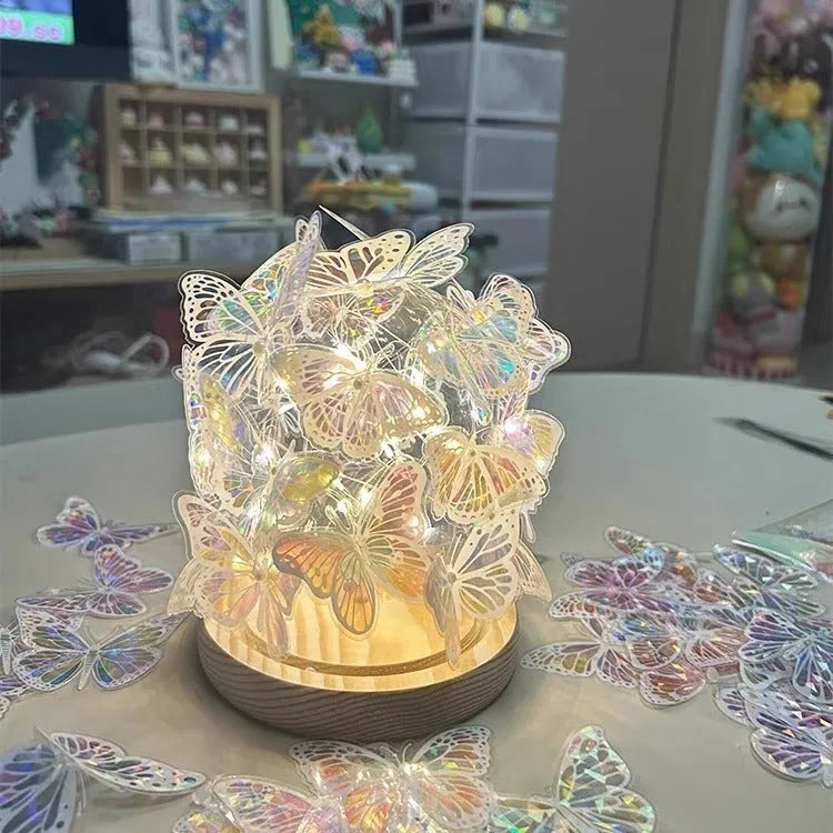 Butterfly shaped night lamp with glass shade and raw wood base on bedside table
