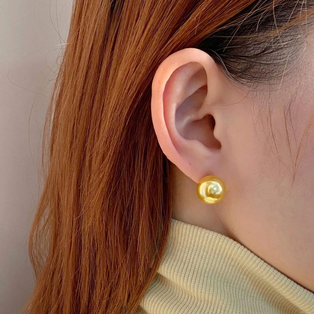 Geometric pearl stud earrings with Awn star motifs in silver, showing size options