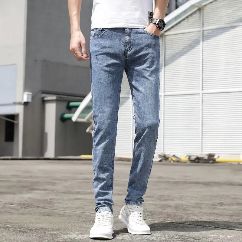 Men's Korean-style light blue tapered jeans with polyester denim blend fabric