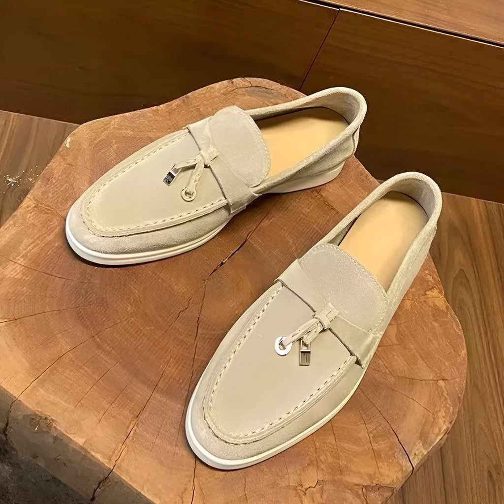 Casual slip-on Gommino loafers in black with round toe, rubber sole, and high-top design.