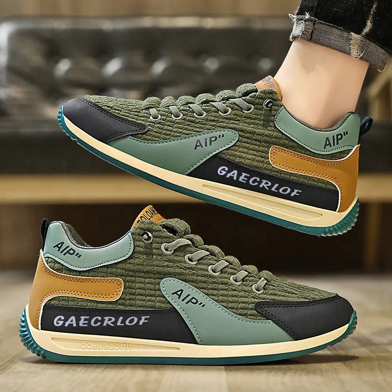 Men's grey and green mesh running shoes with lace-up closure and round toe design
