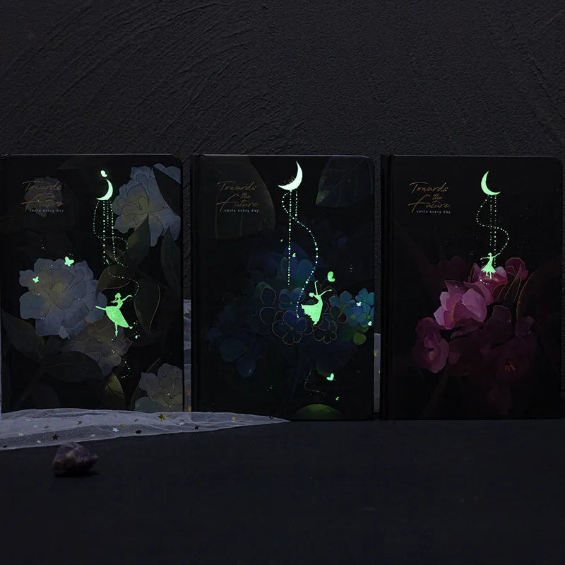 A5 notebook with luminous cover showing colour illustrations on open pages