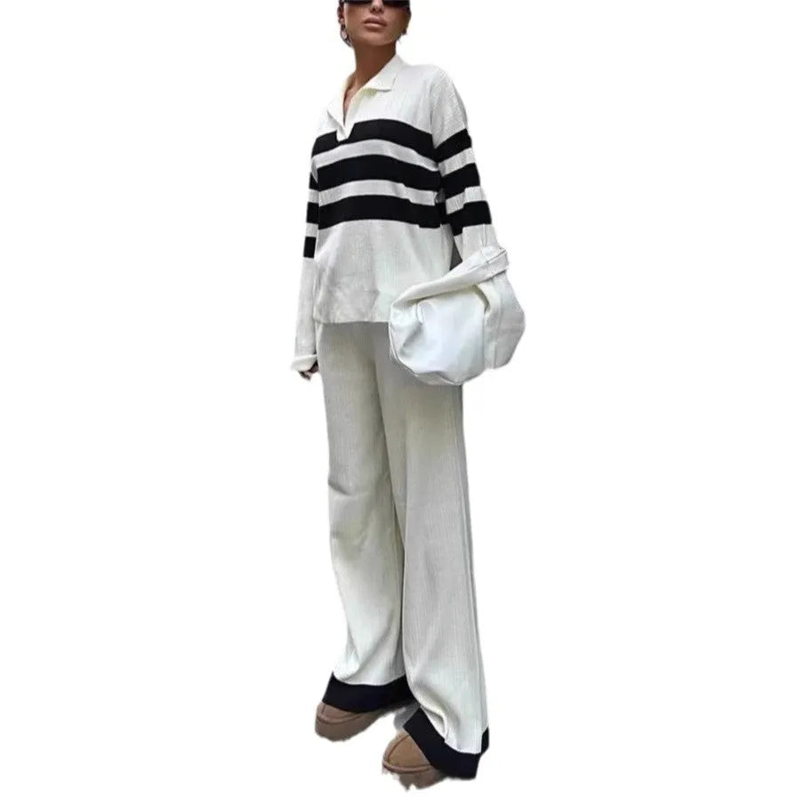 Women's black and white striped knitted polo shirt and trouser two-piece set.
