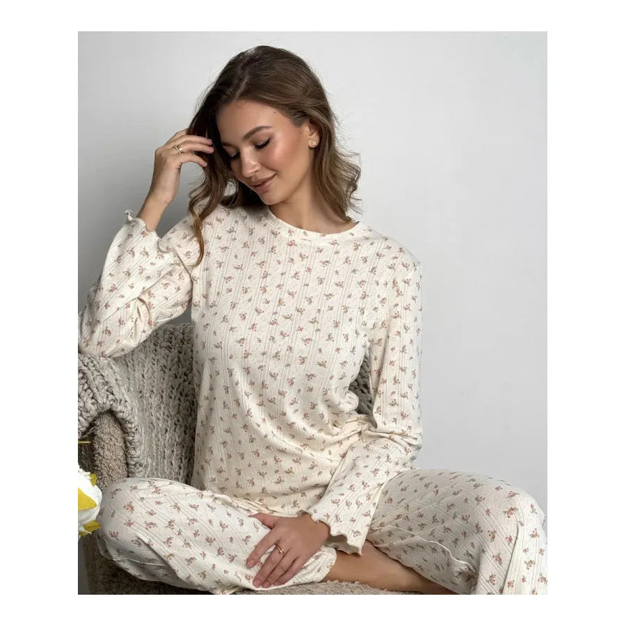 Women's white floral print pyjama set with bell sleeve top and wide-leg trousers