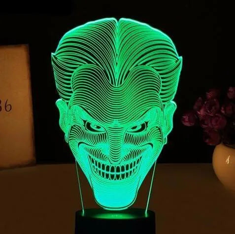 USB-powered 3D acrylic LED lamp showing multiple colour options on a desk