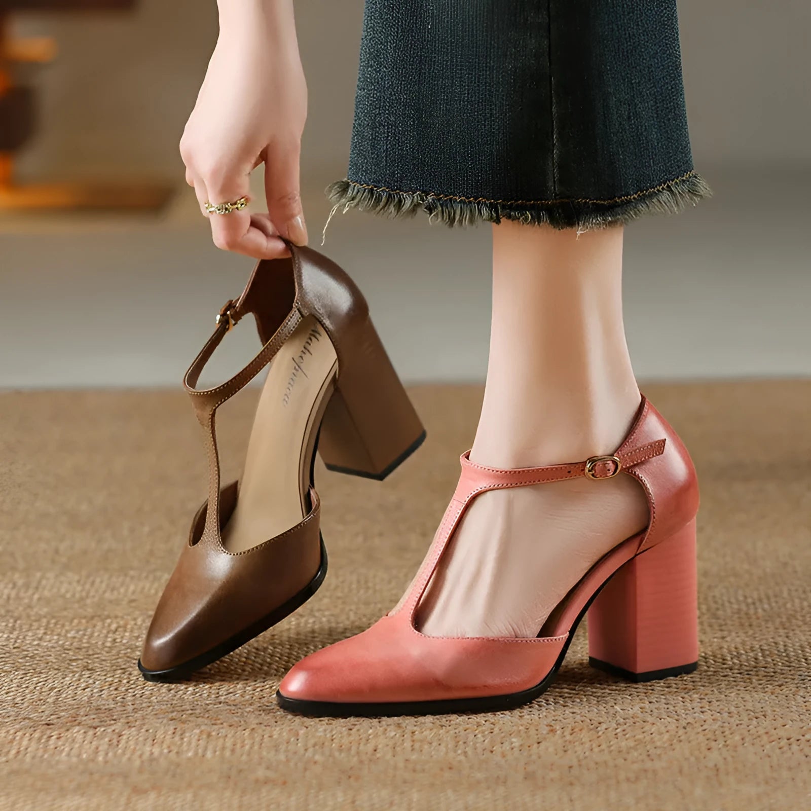 Women's dark brown retro Mary Jane shoes with a pointed toe, hollow Baotou detail, and buckle fastening.