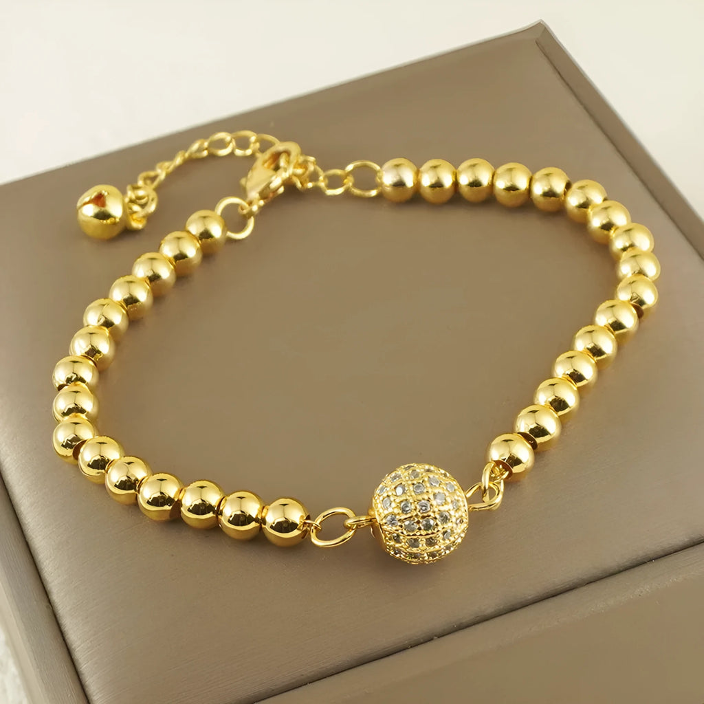 Women's heart-shaped copper bracelet with single ball zircon accents and electroplated finish
