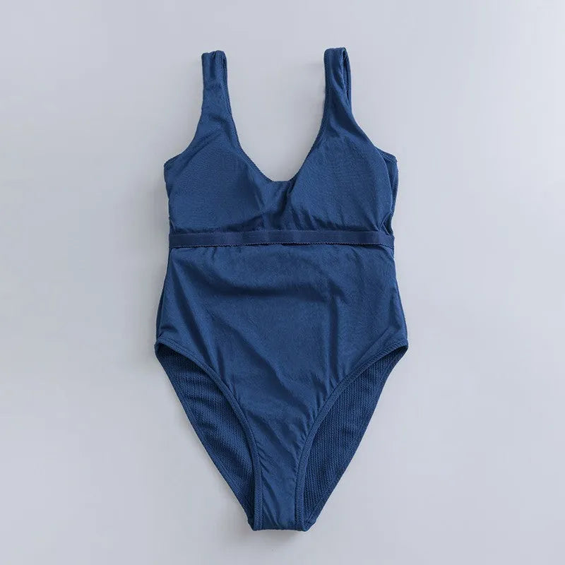 Navy blue women's one-piece slimming swimsuit with removable chest pads