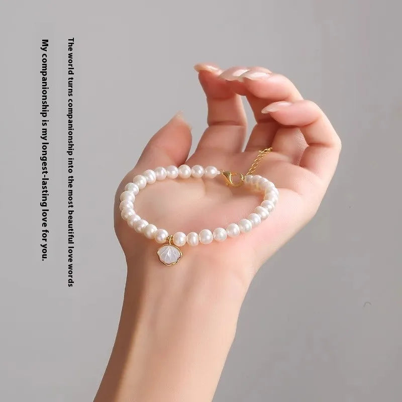 Women's freshwater pearl fan-shaped bracelet with elastic string or extension chain option, 16cm length.
