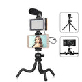 Black Octopus flexible tripod live broadcast kit with attached fill light and microphone on a table