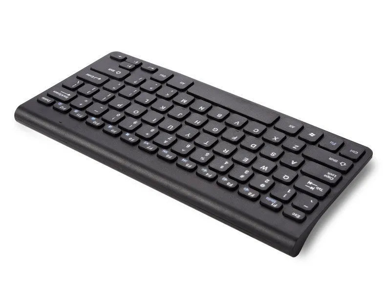 Black wireless keyboard and mouse set on wooden desk showing 2.4GHz wireless operation
