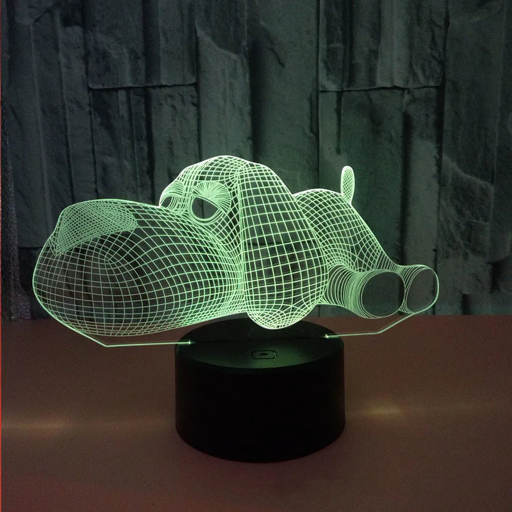 Glowing 3D illusion dog desktop night light showing multiple colour options on a desk.