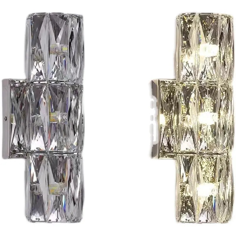 Crystal shade stainless steel wall lamp in chrome finish mounted on a wall.