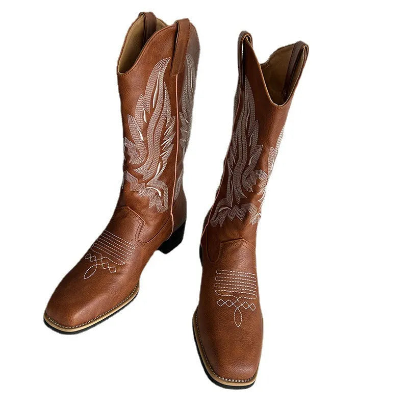 Brown women's embroidered Martin boots with a mid-calf height and low square heel.