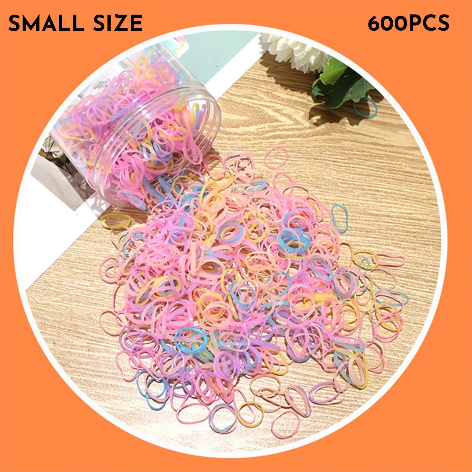 Multi-colour TPU baby hair ties in a reusable plastic storage container.