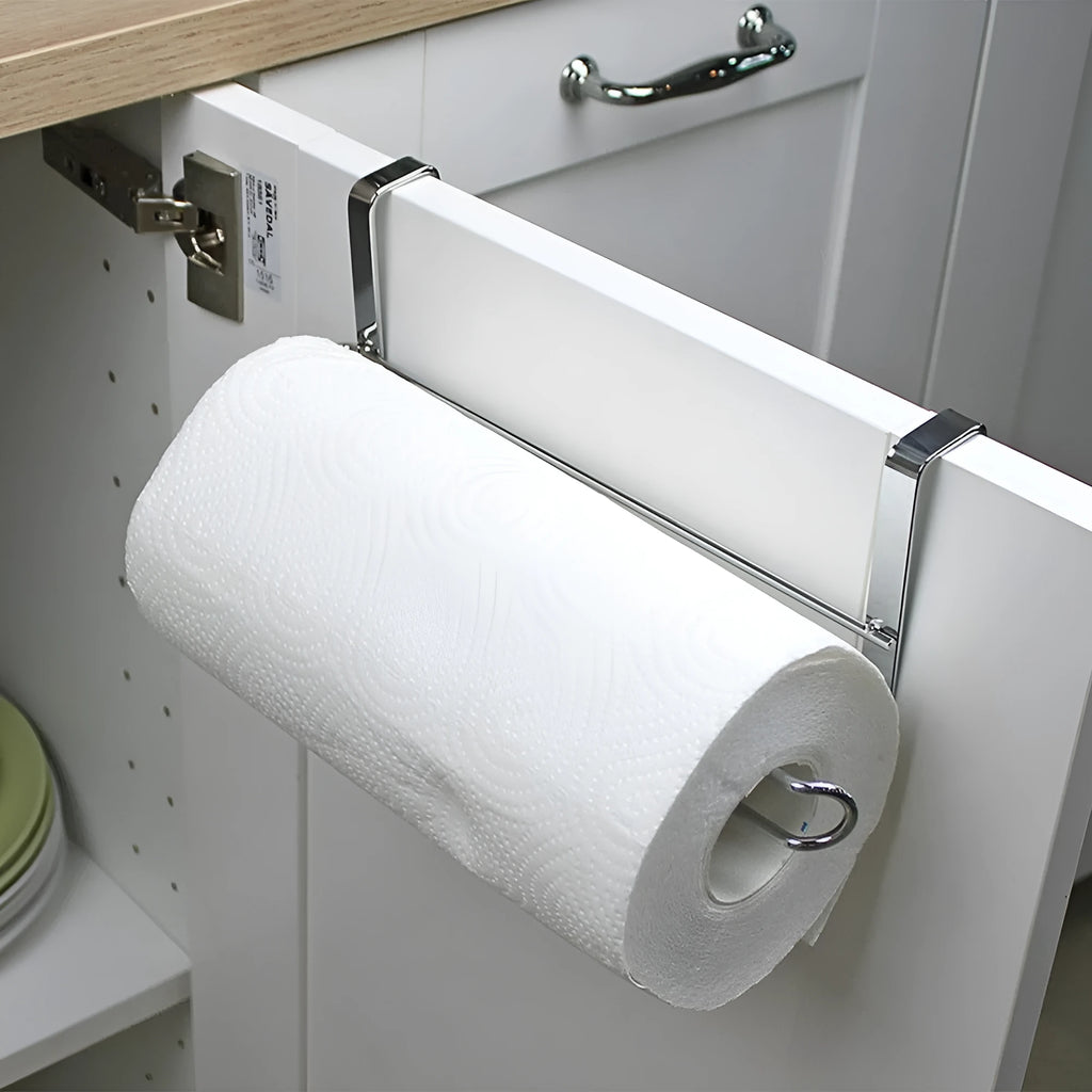 Silver stainless steel paper towel rack mounted on a kitchen cabinet door.